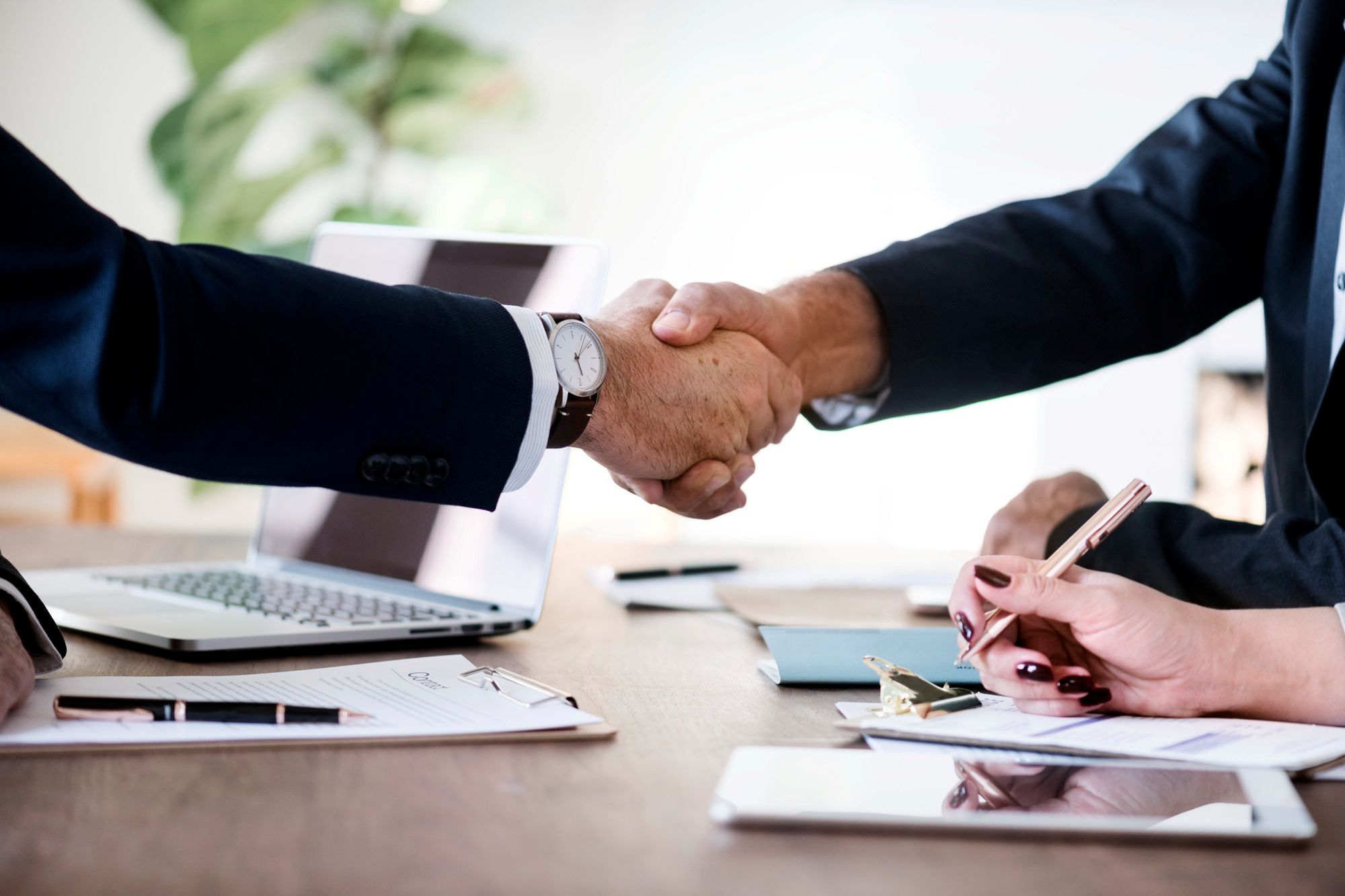 Office workers shake hands